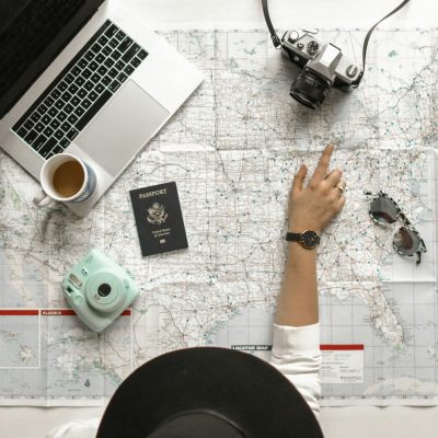 person pointing a location on the map